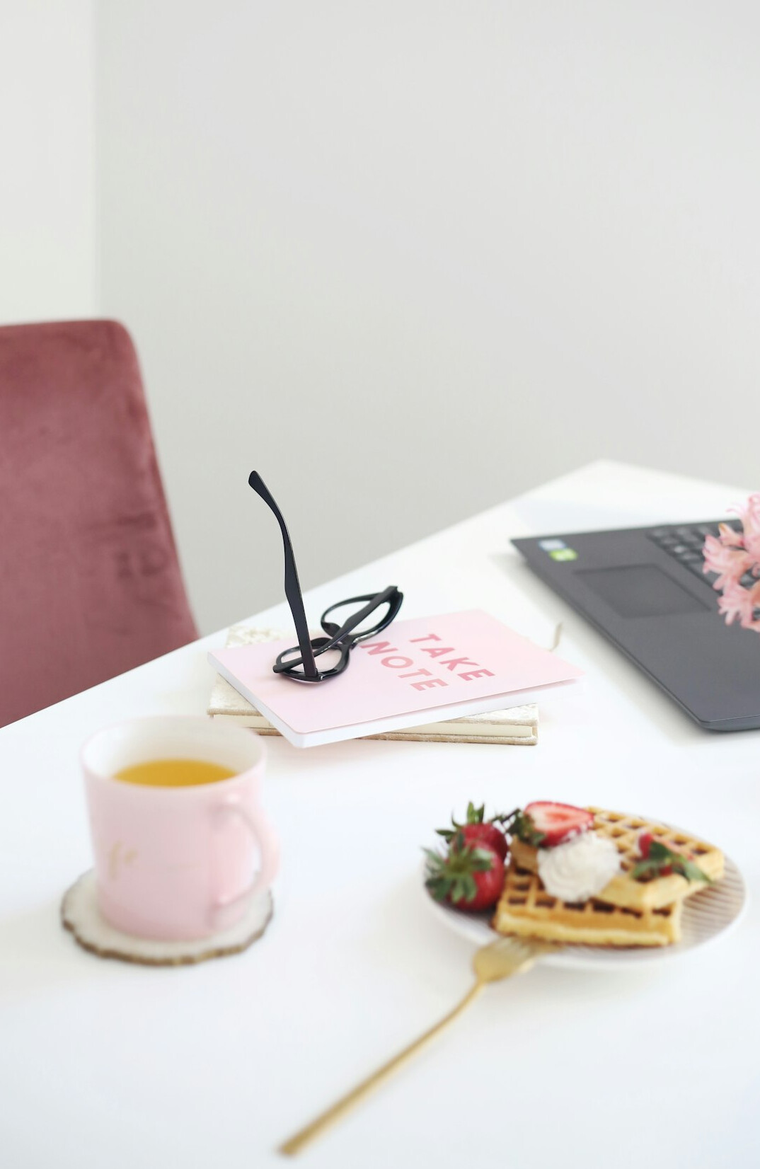 Desk with documents, magnifying glass and laptop for research