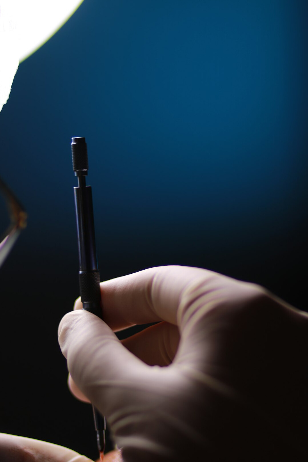 Researcher annotating printed documents with a pen